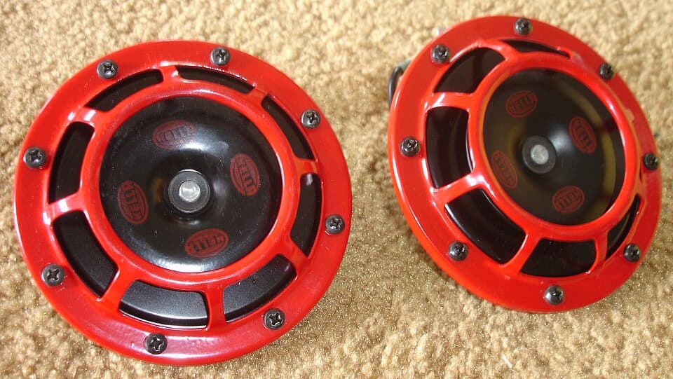 Pair of red and black electric vehicle horns