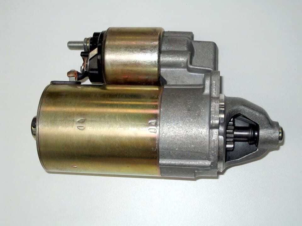 Automotive starter motor with solenoid and pinion gear