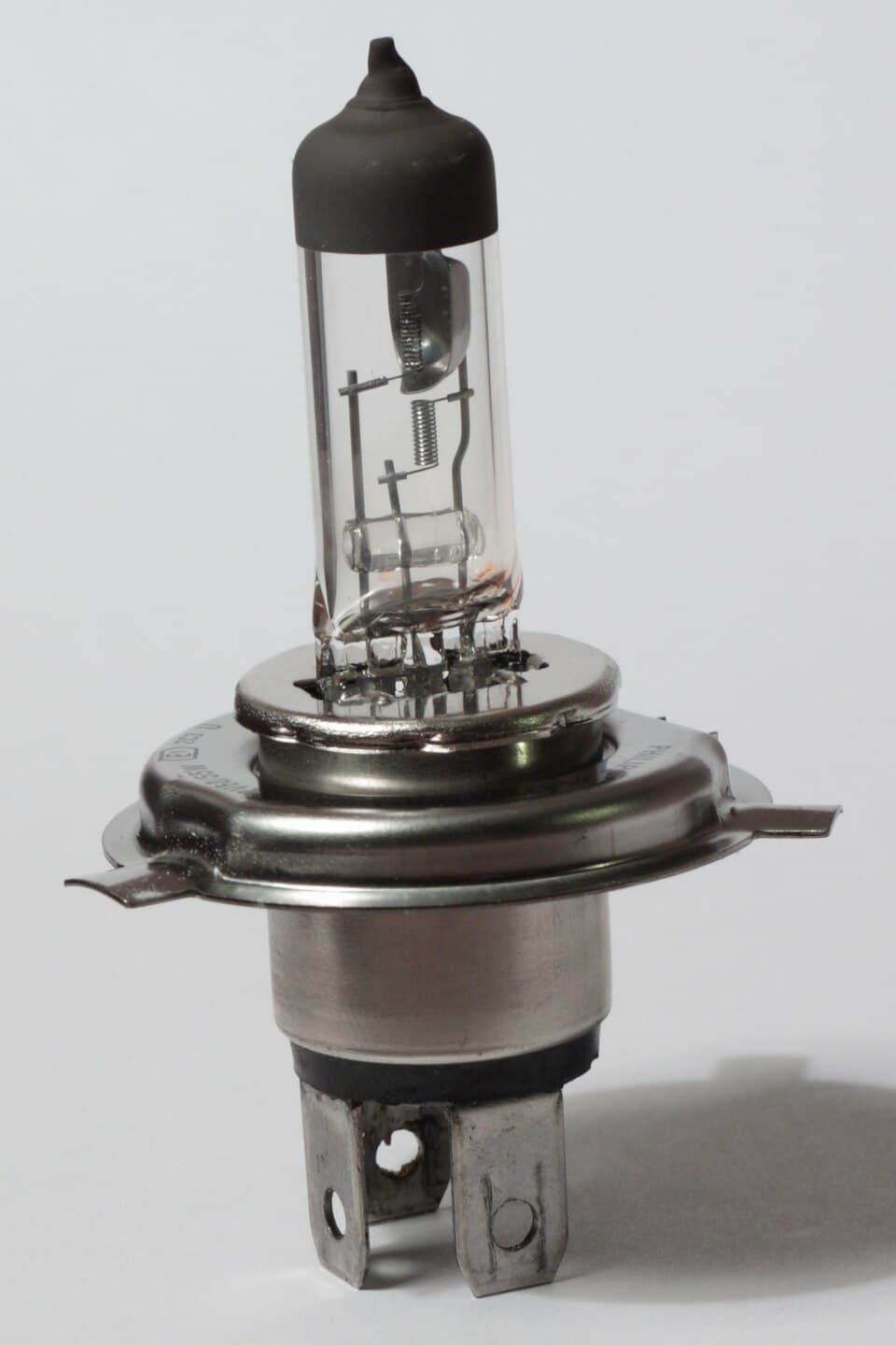 H4 halogen headlamp bulb showing the glass envelope and electrical contacts
